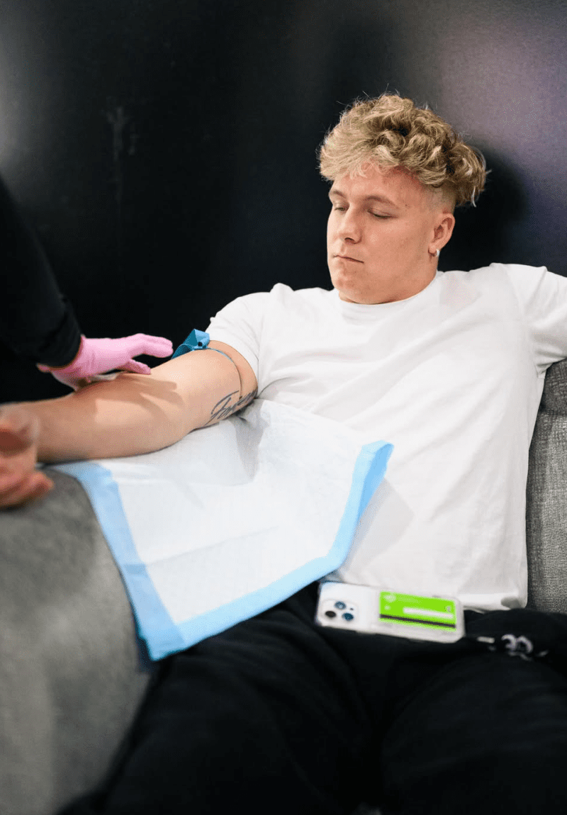 Patient receiving mobile IV therapy for hydration and recovery