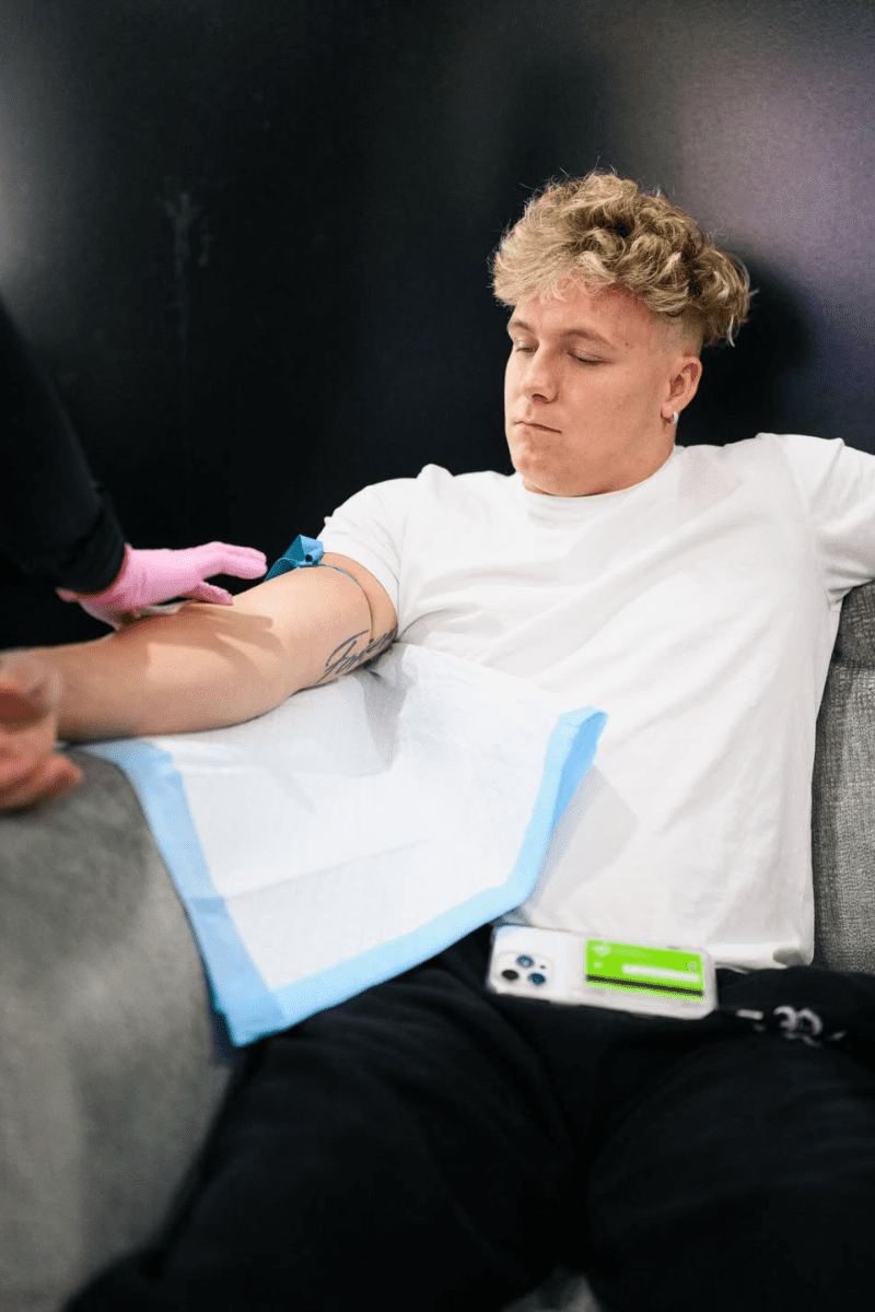 Patient receiving mobile IV therapy for hydration and recovery